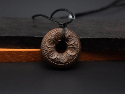 tibet buddhism,buddhism pendant,wood carving,wood pendant,carve wooden pendant,Symbolizing reincarnation and the cycle of life.