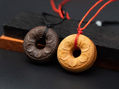 tibet buddhism,buddhism pendant,wood carving,wood pendant,carve wooden pendant,Symbolizing reincarnation and the cycle of life.