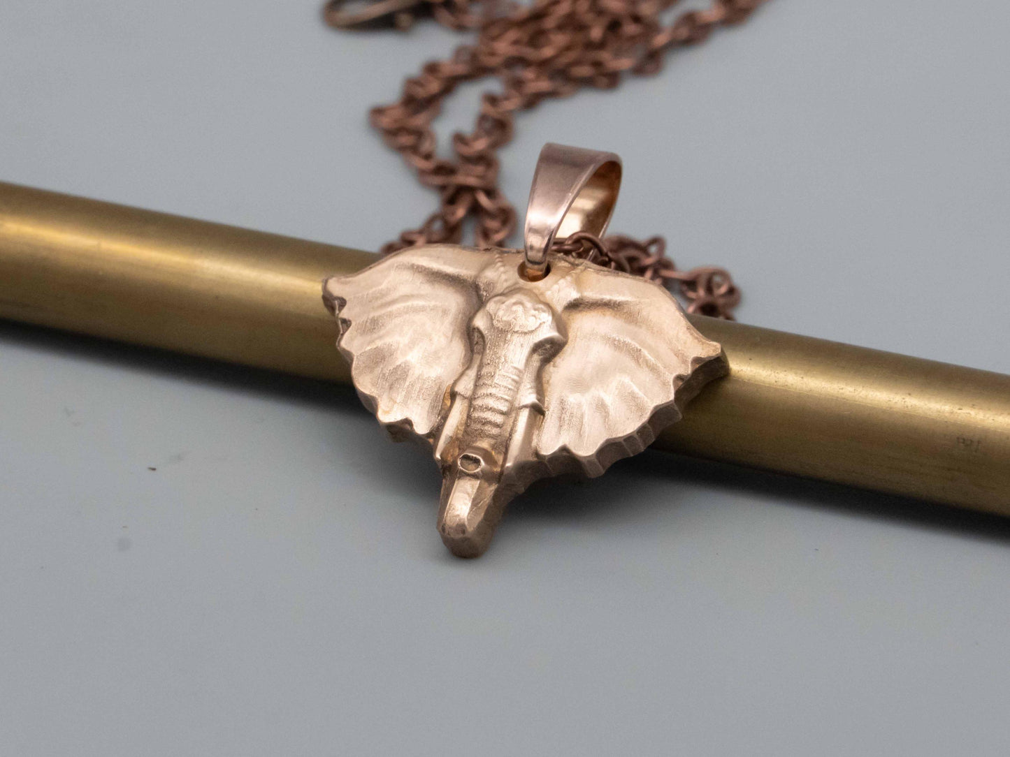 Elegant Bronze & Brass Elephant Art: Pendants, Necklaces, Reliefs, and Vintage Carvings - Shop Now!