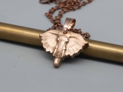 Elegant Bronze & Brass Elephant Art: Pendants, Necklaces, Reliefs, and Vintage Carvings - Shop Now!