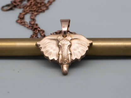 Elegant Bronze & Brass Elephant Art: Pendants, Necklaces, Reliefs, and Vintage Carvings - Shop Now!