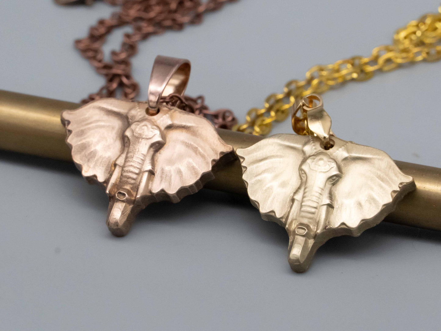 Elegant Bronze & Brass Elephant Art: Pendants, Necklaces, Reliefs, and Vintage Carvings - Shop Now!